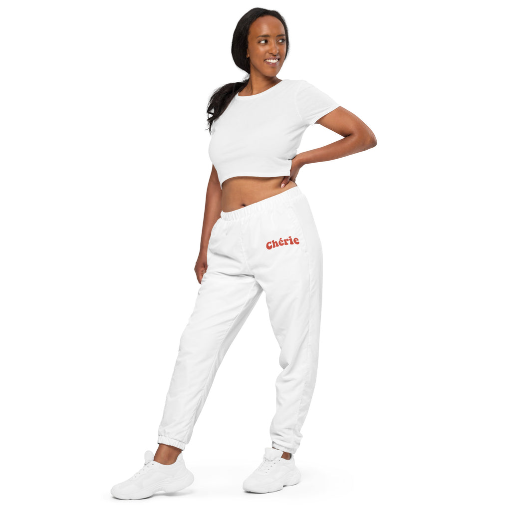 Woman modeling Chérie white track pants