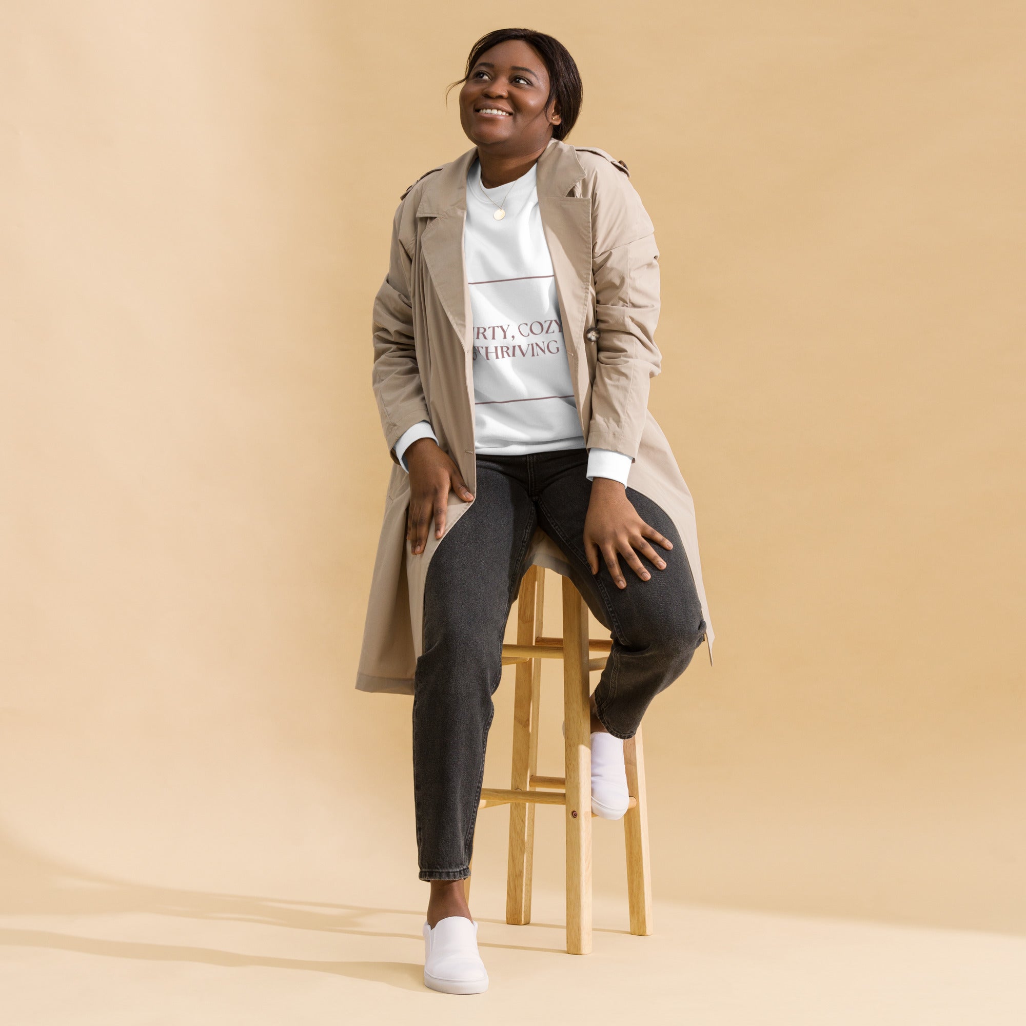 woman modeling fun white sweatshirt and a trench