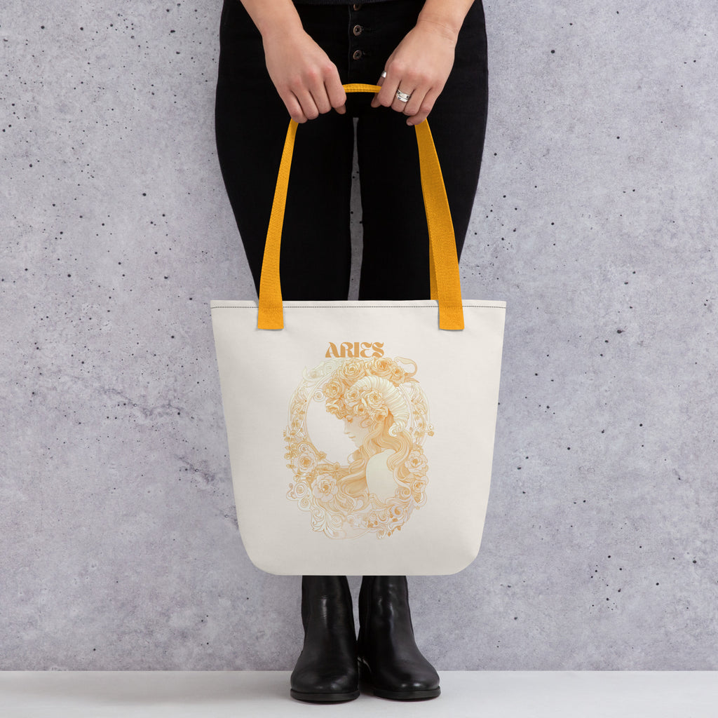 Woman holding an Aries astro tote bag