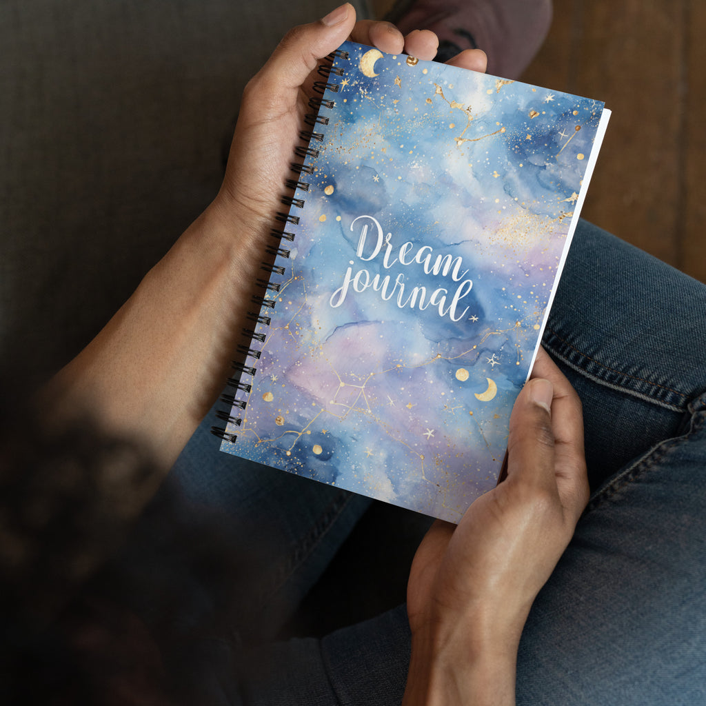 man holding spiral notebook